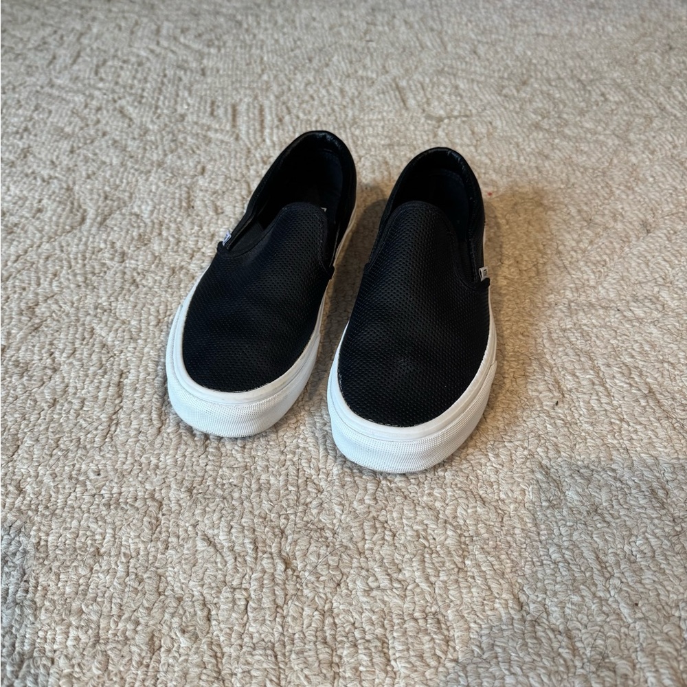 Vans Black and White Slip-On Sneakers